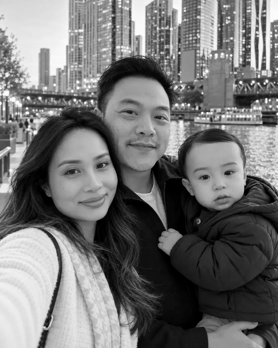 Mindy with her family in a black-and-white photo